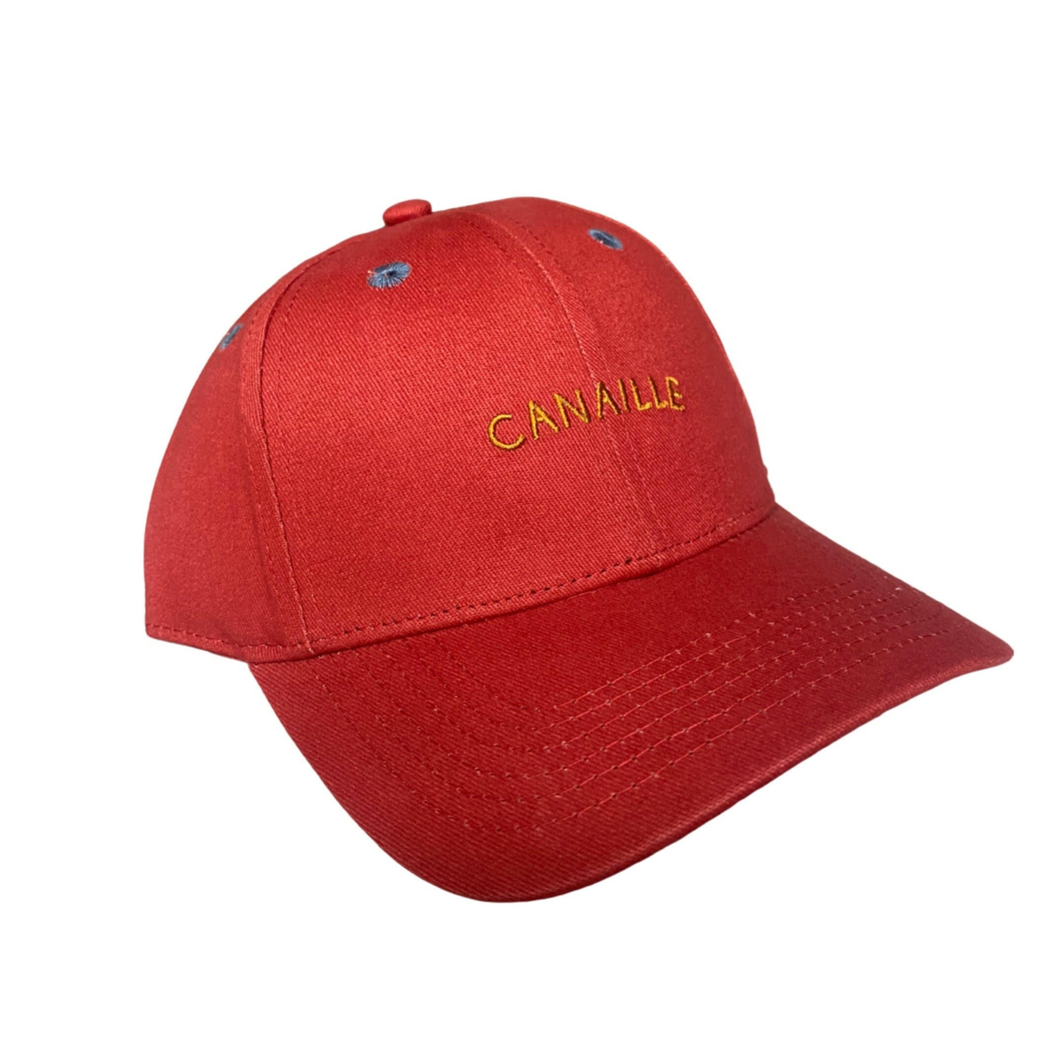  casquette pour enfant est parfaite pour compléter le look de votre petit bout avec style et confort. De couleur rouge, elle est agrémentée d'une broderie jaune "Canaille" 